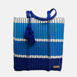 large tote handwoven using recycled plastic cord. designed in us. handmade in Guatemala. design is three large color bands in a gradient of blues including sky blue, royal blue & dark blue